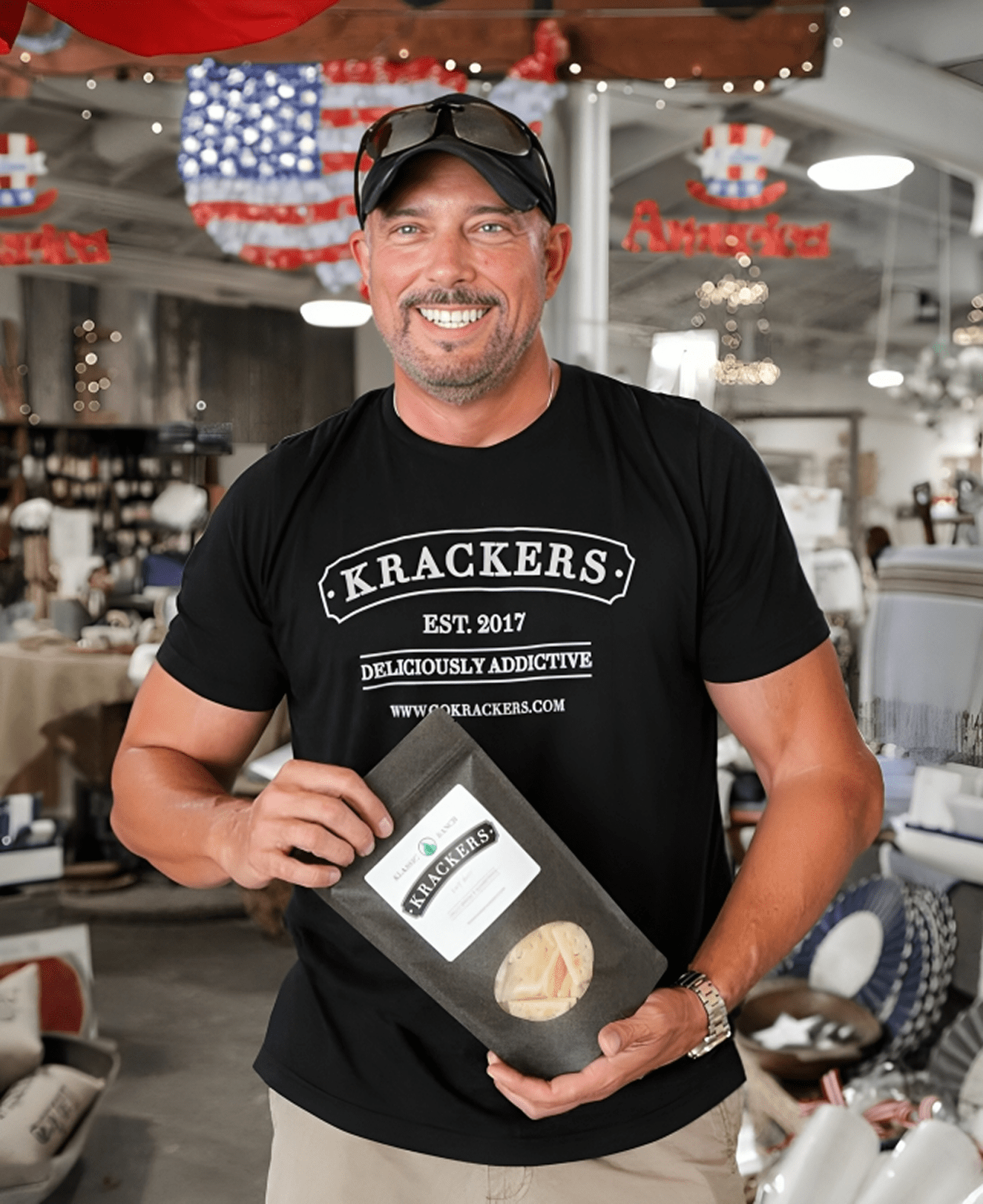 Man holding a package of Krackers product.