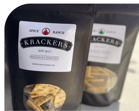 Spicy ranch crackers in black packaging.